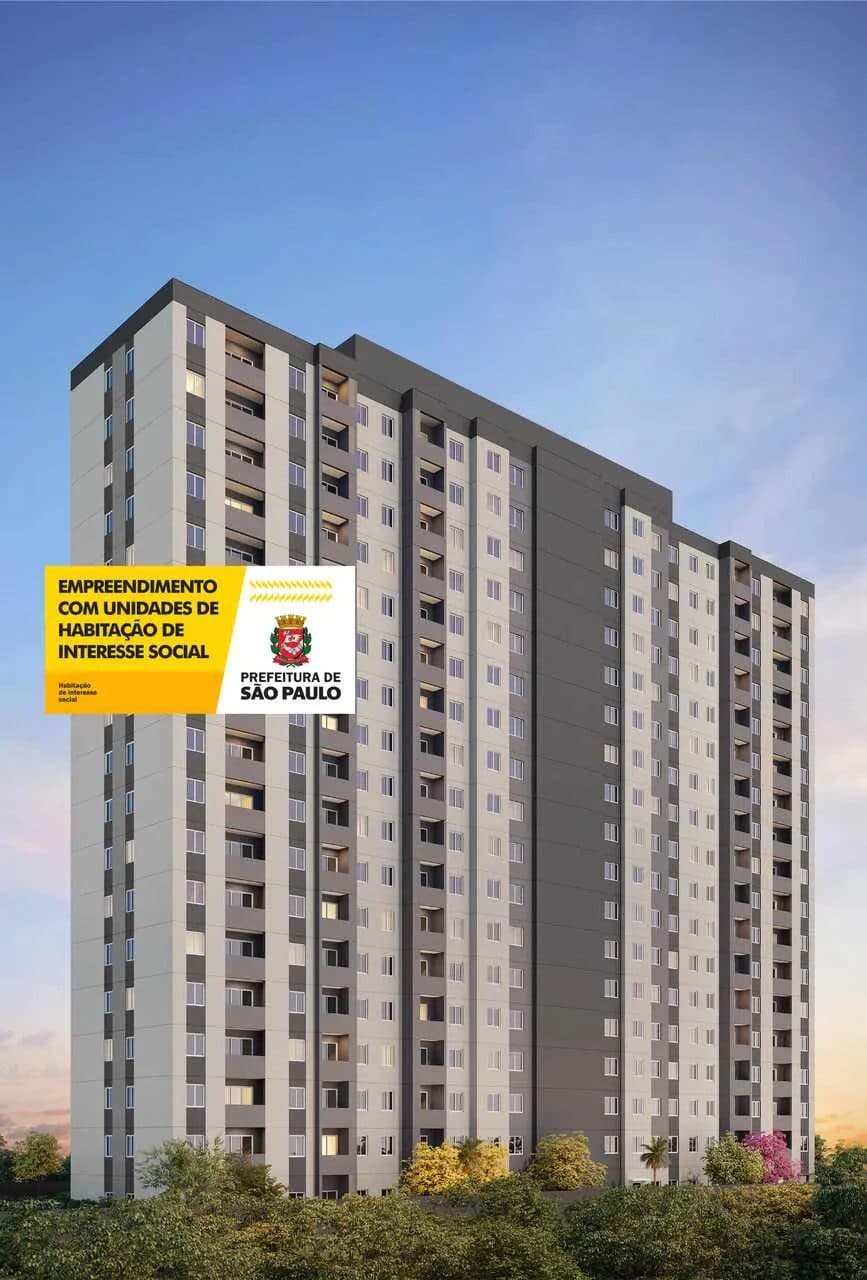 Fachada externa do edificio residencial com pintura em tons de cinza e branco.